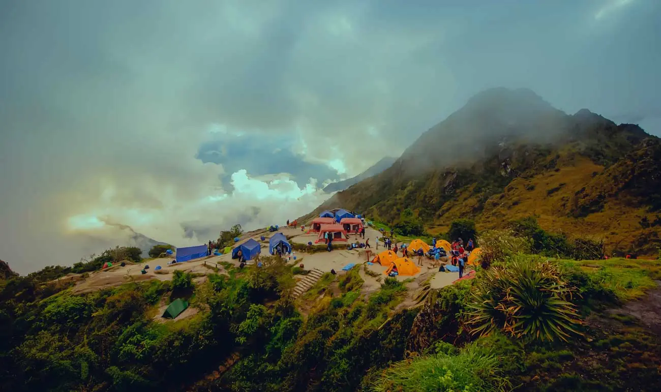 Phuyupatamarca campsite with tents and Andean peaks on the 5-day Inca Trail