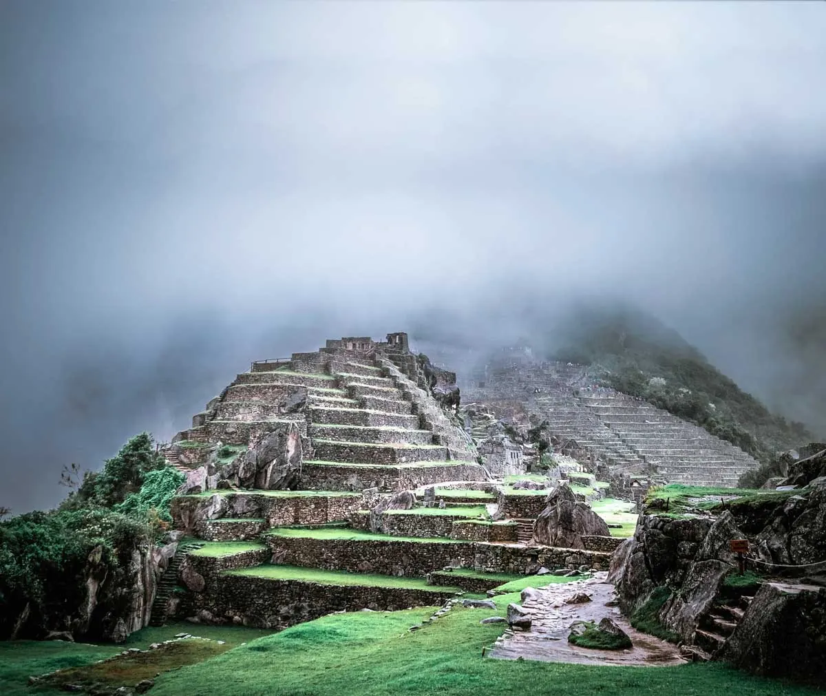 Inca terraces and buildings at Machu Picchu in the clouds