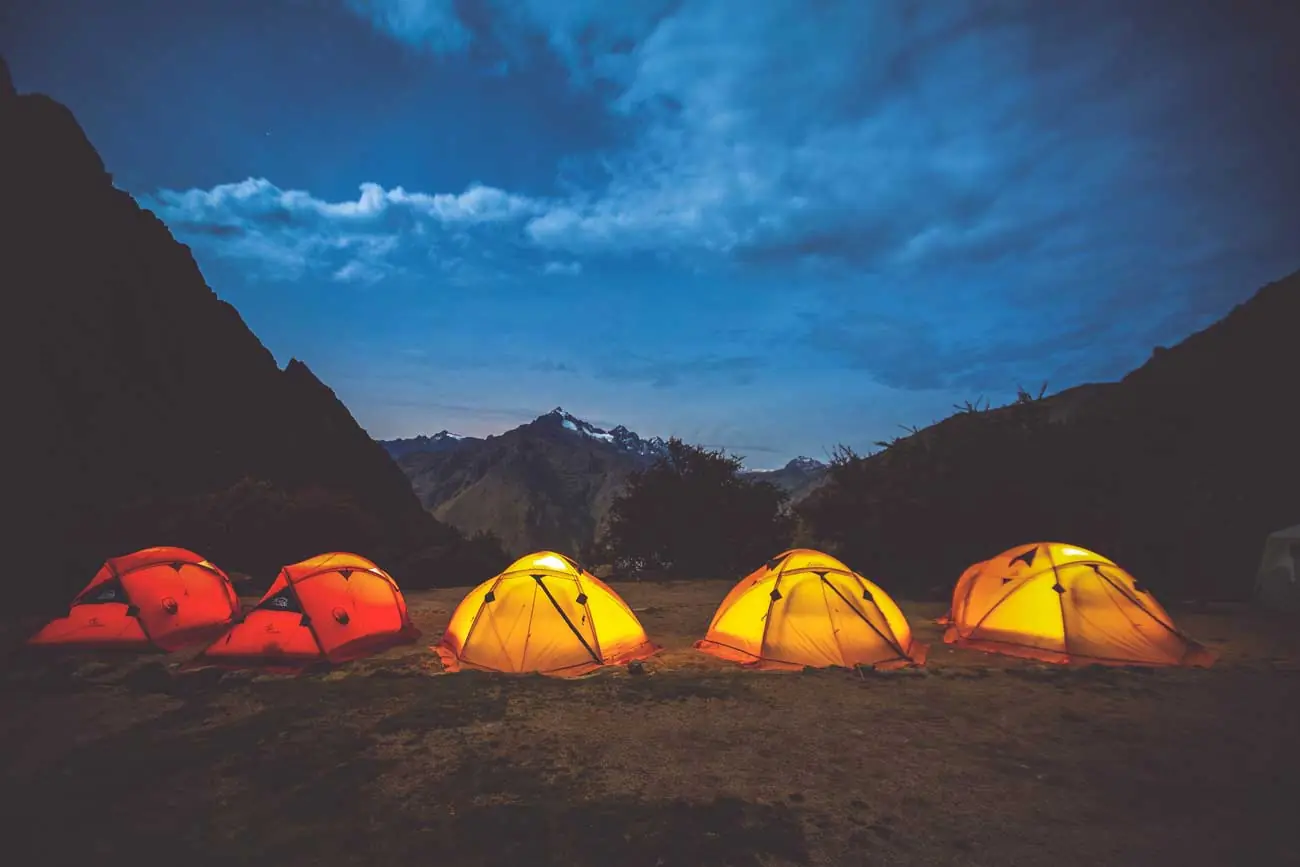 Tents glowing at night at an Inca Trail campsite