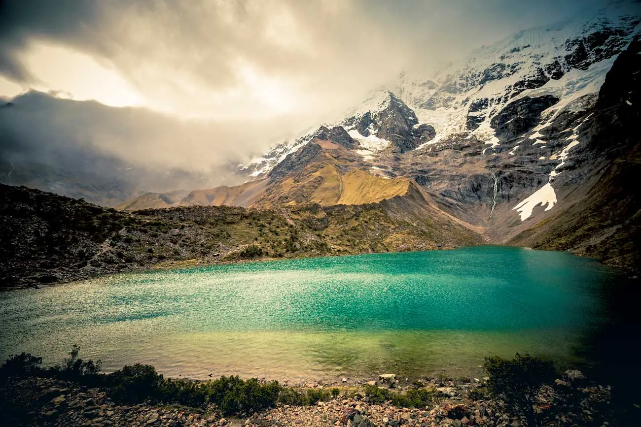 Turquoise Humantay Lake below the snowy peaks