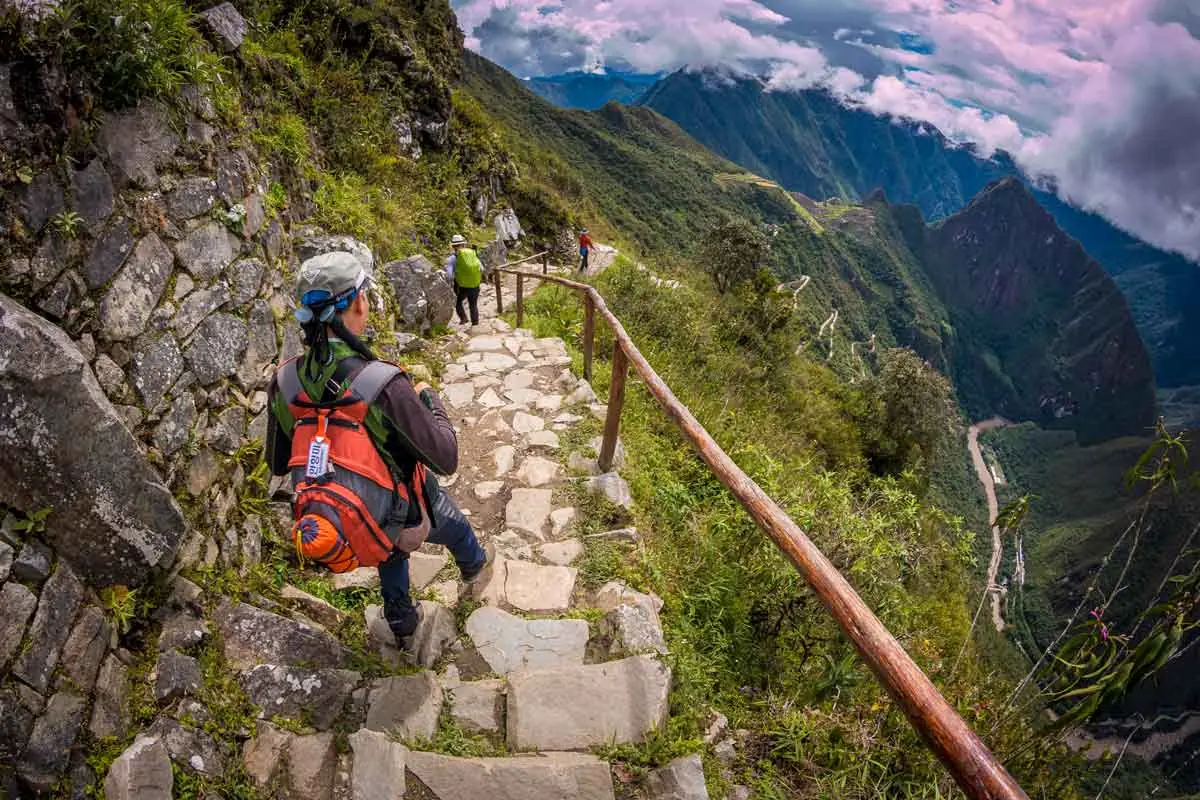 Hiker on the stone steps of the Inca Trail near Inti Punku (Sun Gate)