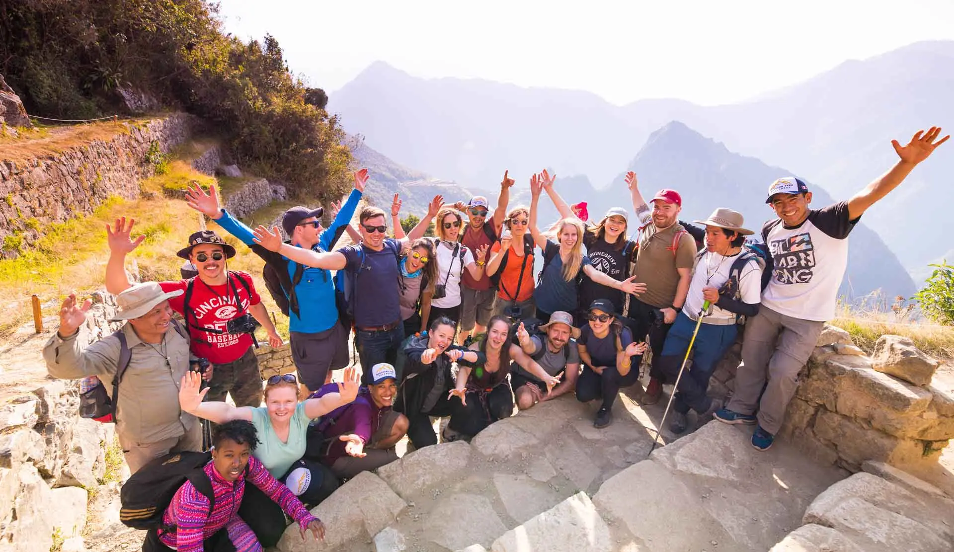 Group cheering on an Inca terrace during the Short Inca Trail with hotel