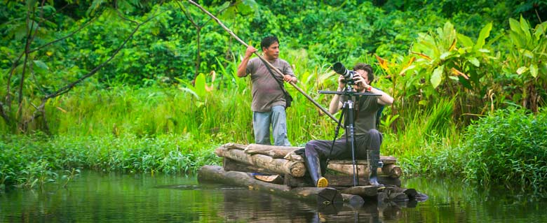 Unforgettable Manu Trip:a man taking photo of the jungle 

