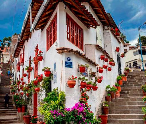 Beautiful view of Street 7 Borreguitos in Cusco with stone-paved alley, colonial architecture, and traditional Andean charm