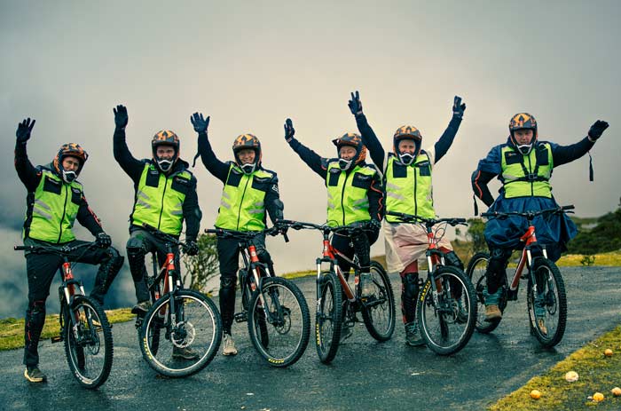 Cyclists descending the mountain during the Inca Jungle Trek adventure on the way to Machu Picchu.