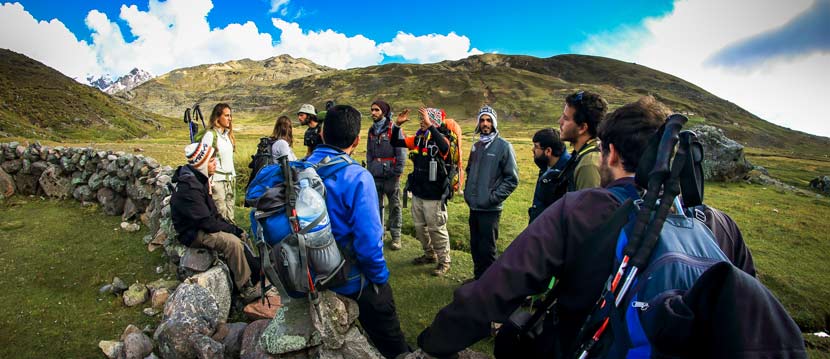 People enjoying their tour in Peru with travelers exploring Inca sites, hiking mountain trails, and experiencing Andean culture and landscapes