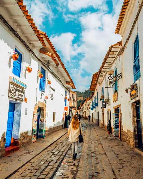 San Blas Street in Cusco with cobblestone paths, colonial houses, artisan workshops, and panoramic views of the historic city