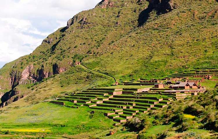 Huchuy Qosqo archaeological site in Peru with Inca stone structures, agricultural terraces, and panoramic views of the Sacred Valley
