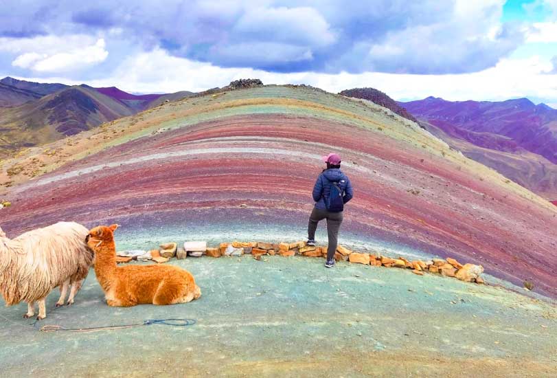 Palcoyo Mountain in Peru with colorful mountain ranges, red valleys, and panoramic views of the Andes with fewer tourists