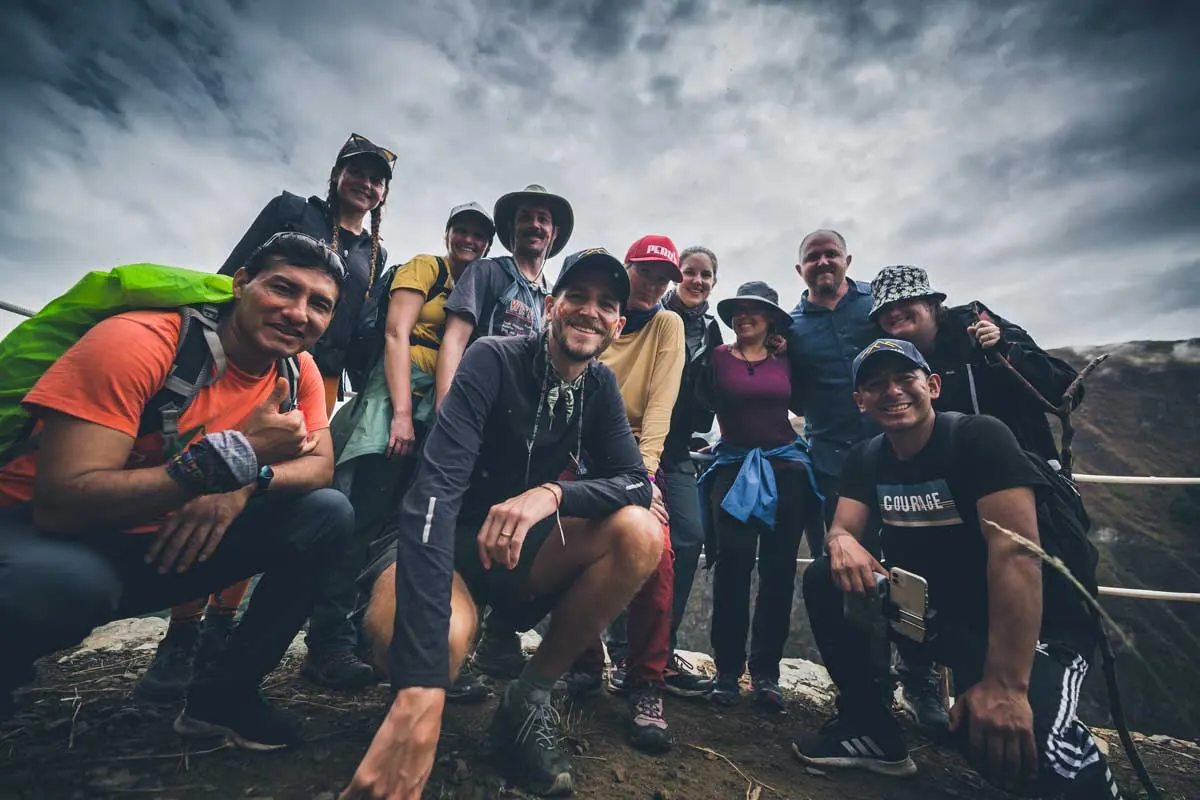 Group of hikers posing on a mountain trail