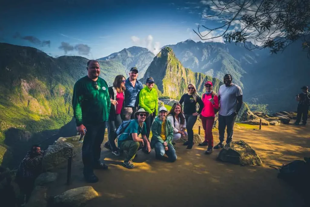 Group with their guide at Machu Picchu with Huayna Picchu behind