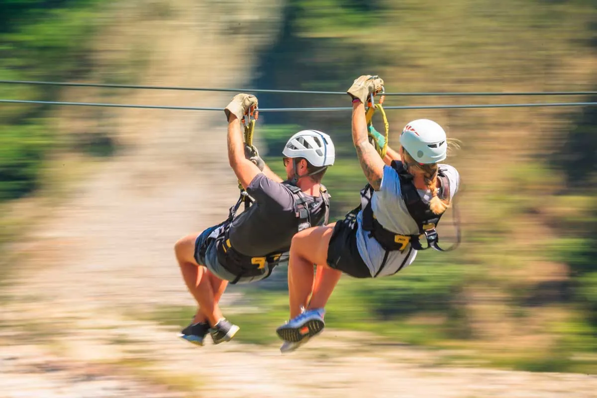 Two travelers on a zipline