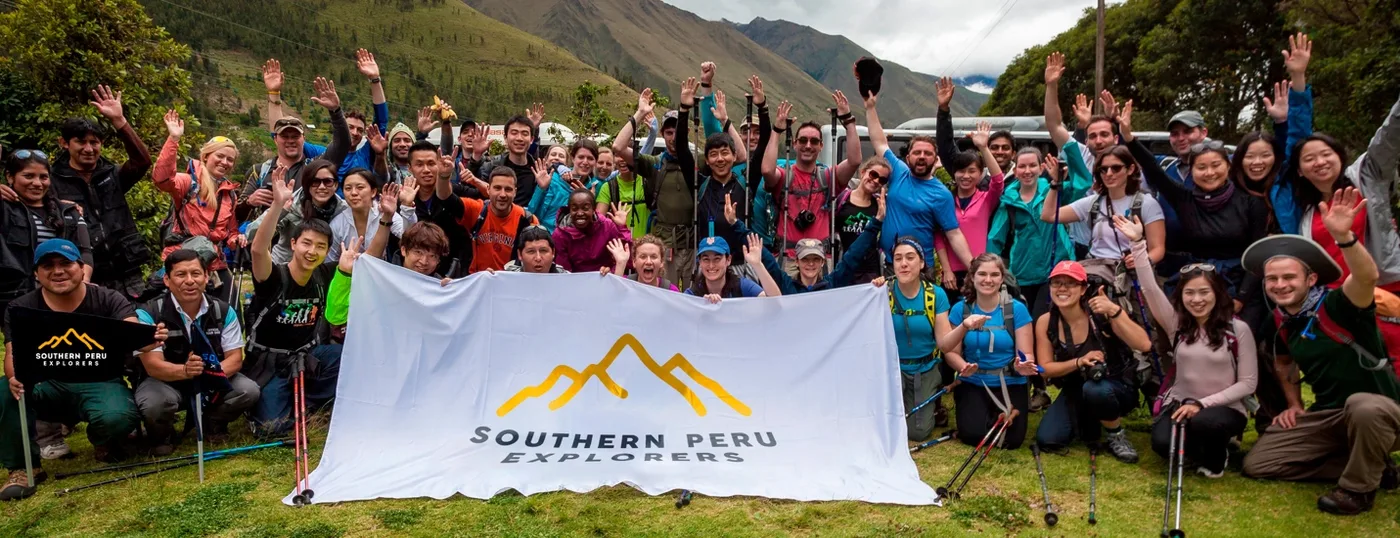 A Southern Peru Explorers trekking group with the company banner